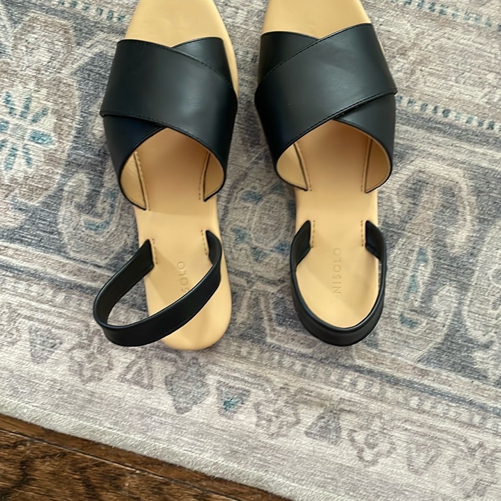 Black Open-Toe Sandals by Nisolo.